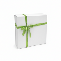 White gift box with a green ribbon and 'Gift Boutique' branding on a white background