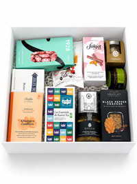 Tea and delicacies gift box with Kusmi Tea, dark chocolate, cured sausages, truffle cheese, and artisan crackers in a signature gift box
